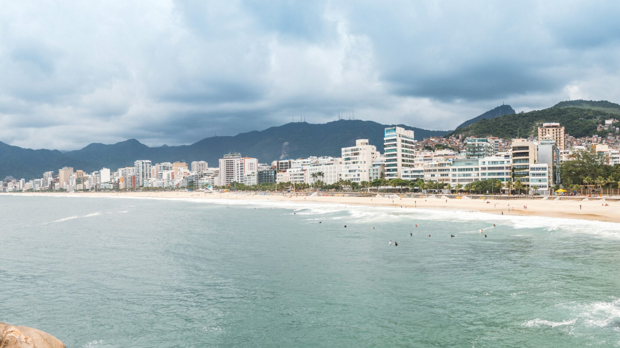 Bright panoramic city beach with mountains and ocean