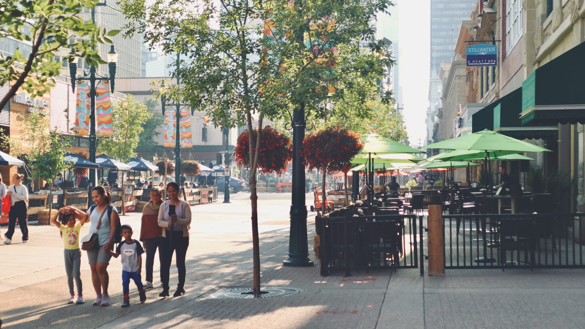 People walking through a bright international city neighborhood