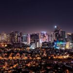 Makati skyline at night in Metro Manila Philippines to compare Manila and Cebu for long stays