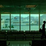 Solo traveler in an airport arrival area for a first-24-hours safety checklist