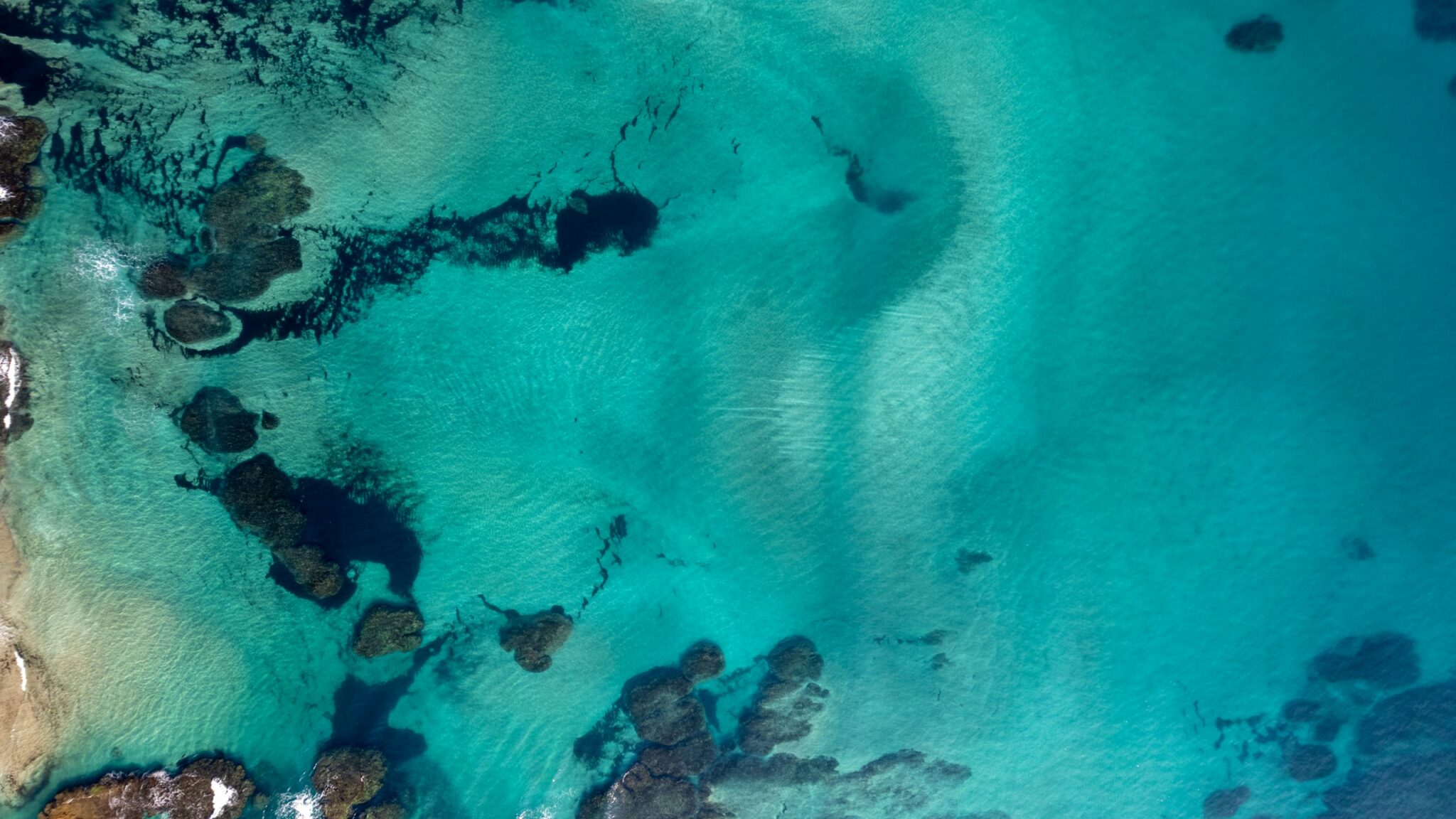 Bright aerial tropical coastline and turquoise water
