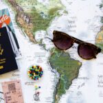 World map and travel planning materials for building a realistic 30-day travel budget