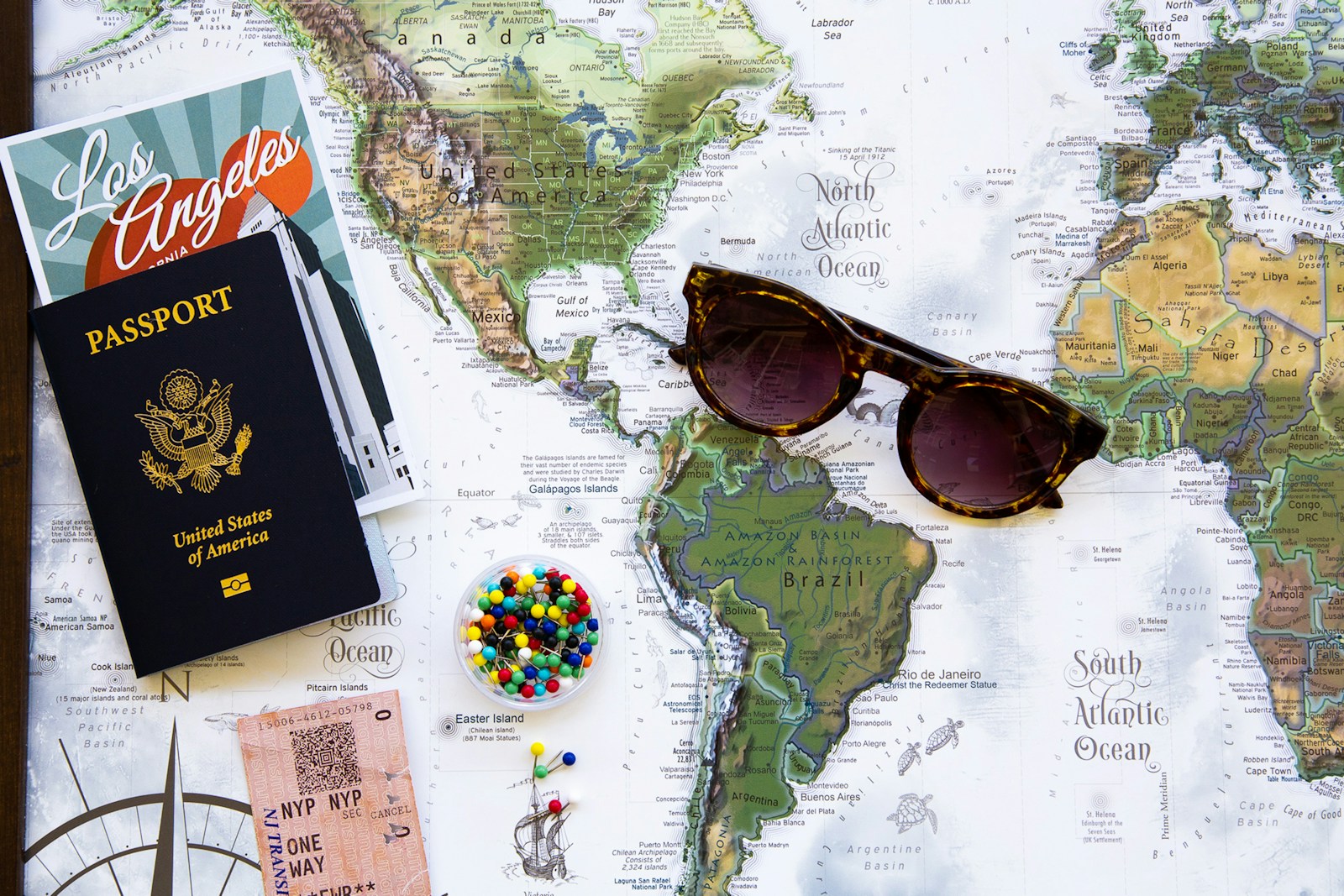 World map and travel planning materials for building a realistic 30-day travel budget